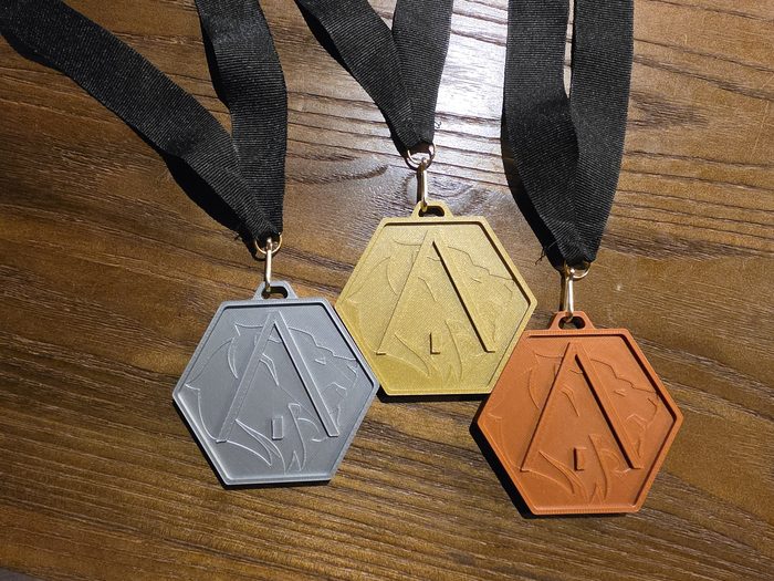 Médailles hexagonales or, argent et bronze
